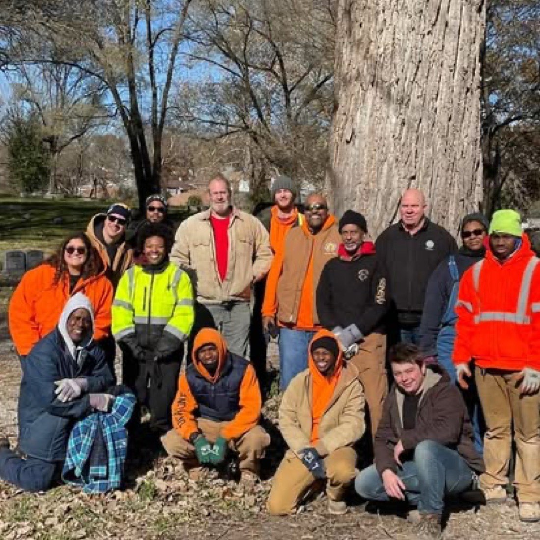 Volunteers gathered at a community cemetery cleanup